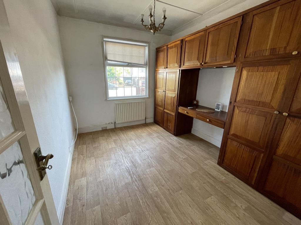 Lot: 84 - DETACHED BUNGALOW & GARAGE WITH POTENTIAL - inside image of ground floor bedroom from hallway